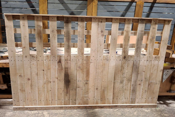 A panel of fencing with a built in trellis-like top half